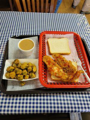 Lemon-pepper catfish sandwich with a side of white beans and fried okra