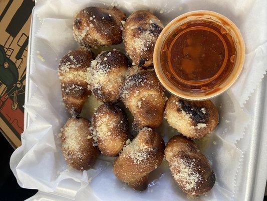 Burnt Garlic Knots with a watery marinara