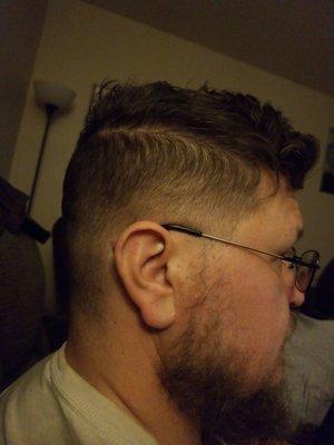 Men's hair cut side done by student.