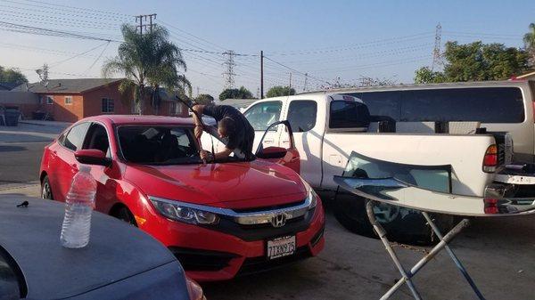 Alex repairing  my windshield