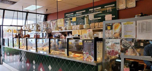 Buffet line - various hot, cooked items are kept hot on a steam table behind the glass.  There is no self-service here.