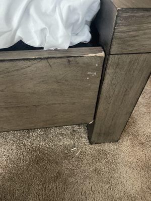 Wood chipped, scratched, damaged on every side of my bed frame