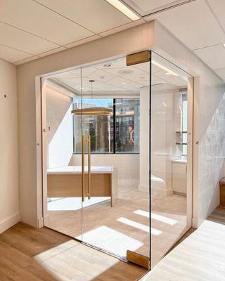 Frameless 1/2" door and panels enclosing office