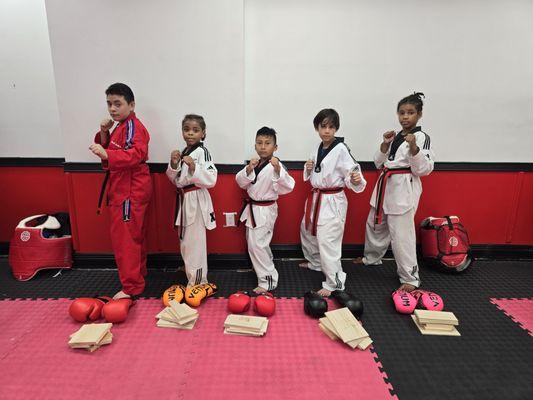 Tkd, breaking boards, and some kickboxing self defense for our kids...Just another day