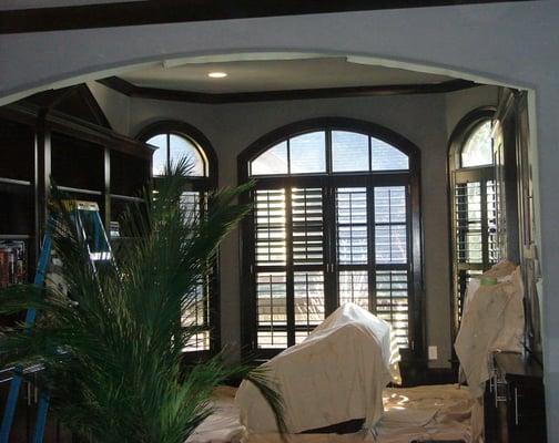 Master bedroom library painted with black trim & suede paint on walls & ceiling of Atlanta home