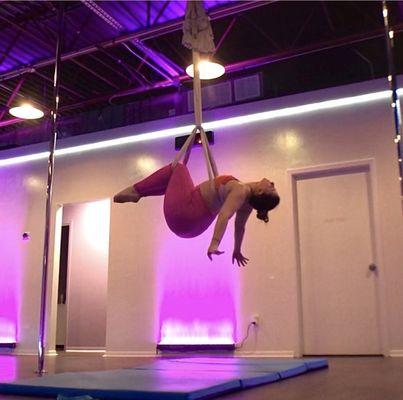 Me working on a cool aerial hammock trick at aerial bombshell!