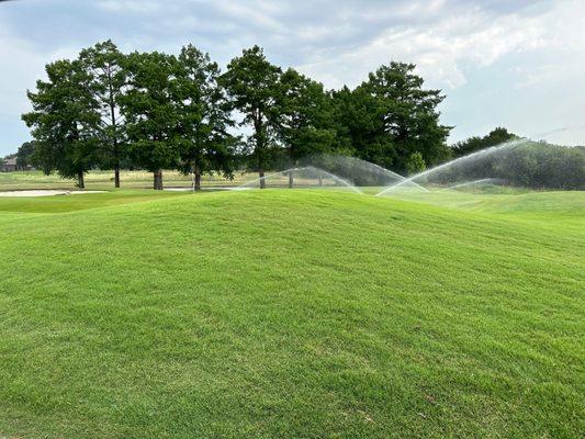 Sprinklers on lots of fairways and greens