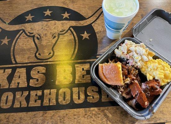 Two meat plate with Beef Brisket, Pulled Pork, Mac & Cheese, Barrel Baked Potatoes, Cornbread, & a medium drink.