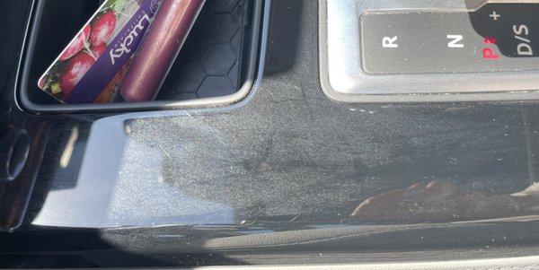 console coated with clear spray from leaving my car doors opened when spraying the outside