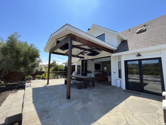 New construction exterior covered porch, including all structural members, with tie-in and matching of existing roof.