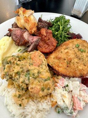 Mixed Brazilian food from the buffet with some meats added.