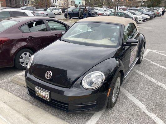 Patrice's car parked in a handicap spot without a tag.