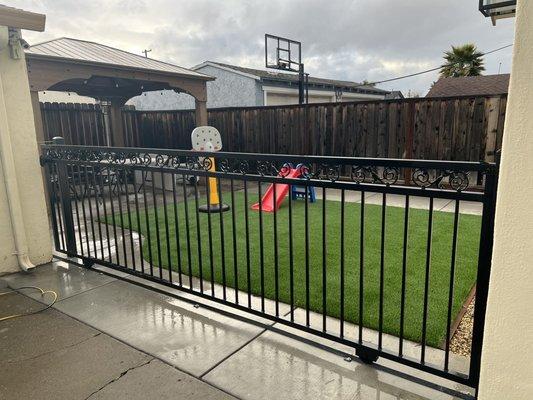 Rolling gate in backyard