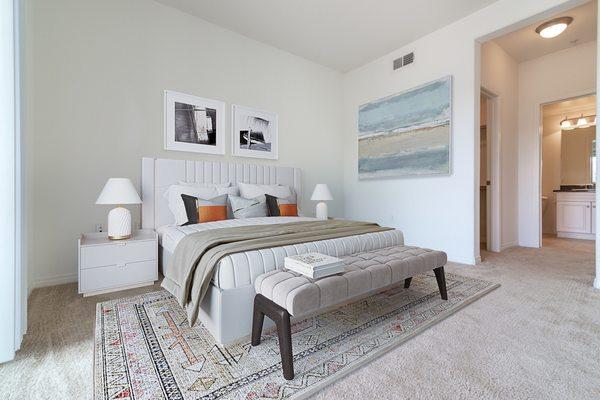 Staged bedroom with ensuite bathroom.