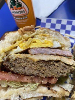 La Callejera beef patty, chicken breast, pork chop, bacon, fried egg & ham, lettuce, tomatoes, onions, cheddar cheese, potato sticks