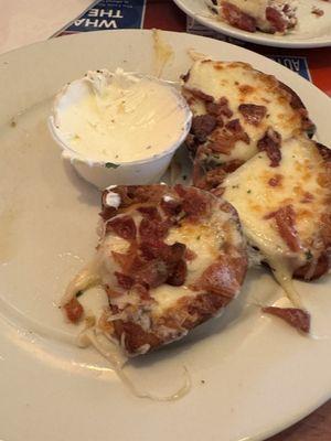 Half eaten potato skins- some of the best we've ever had!