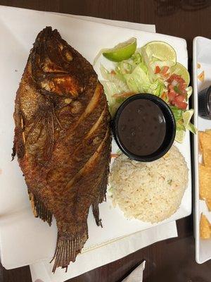 Raw fried fish and heated rice.