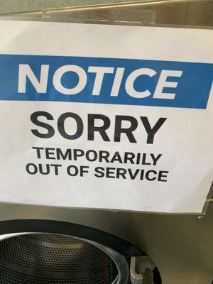 The sign now on the faulty washer