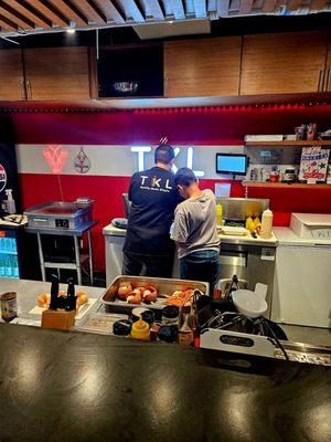 Preparing the orders in the kitchen area