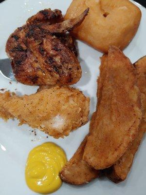 Assortment of baked wings, fried leg, potato wedges, and roll. I added the mustard.