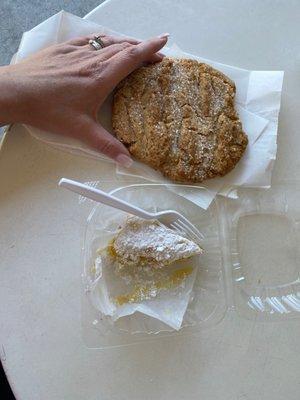 Peanut butter cookie and lemon bar, my hand for scale.