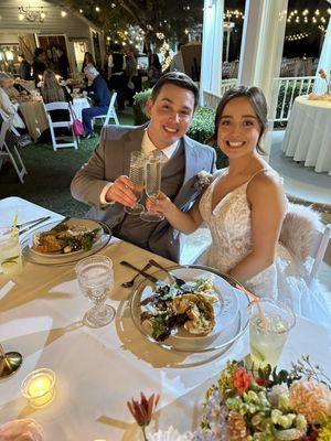 Sweetheart table in front of gazebo area.