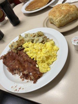 Scrambled eggs, corned beef hash and home fries