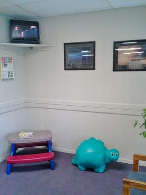 We have a children's area (with toys in the dinosaur) and a TV available for the enjoyment of your families.