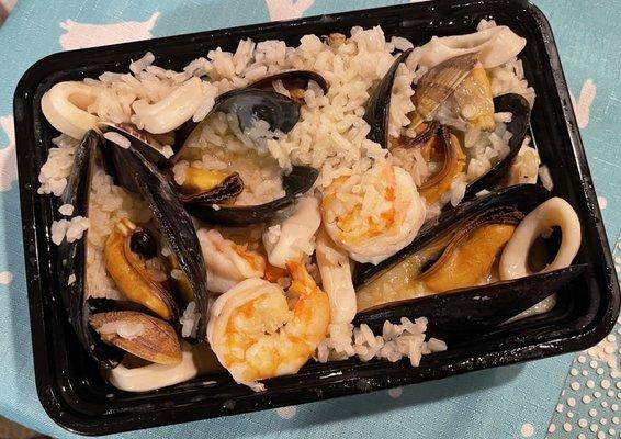 Risotto al Frutti di Mare, with mussels, clams, shrimp, calamari in a white wine sauce