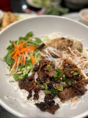 Egg rolls, pork, noddles and Asian salad. Deliciously sweet and salty. The pork had some charred areas and that made it perfect!!