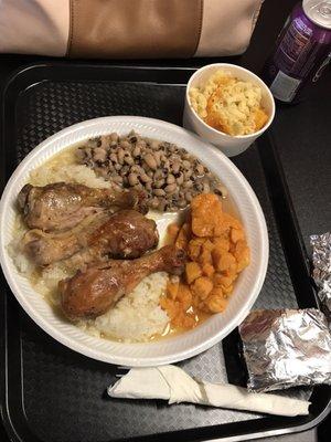 Fall off the bone grilled chicken with white rice and gravy, black-eyed pea's, yams, macaroni and cheese