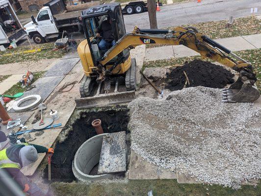 double valve flood control system installation with precast concrete rings.