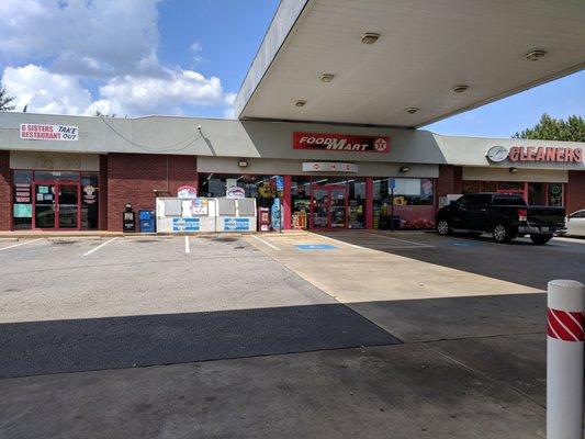 Outside the convenience store. Storefront/entrance.