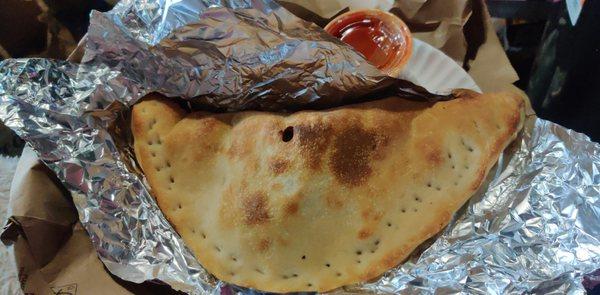 Sausage, pepper, and cheese calzone