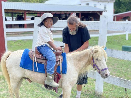 Lil Cowboy Lang riding Cream Puff the Pony