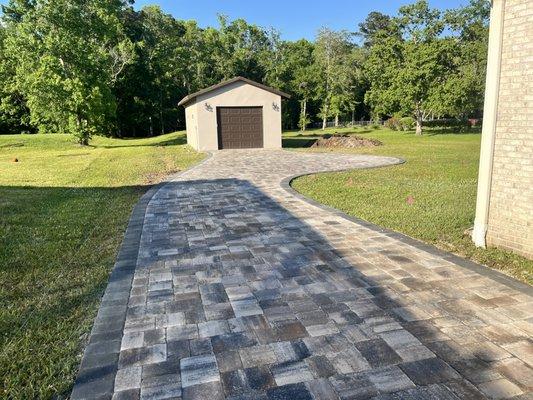 Driveway installed using Mega Olde Towne Pavers LionsBridge Color with Granite border