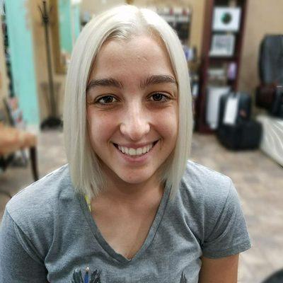 Beautiful color correction. She arrived a brunette and left an awesome sassy platinum blond