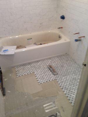 Bathroom floor getting installed