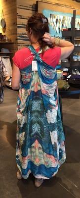 This is a scarf made into a fun vest/ cover up, sarong.