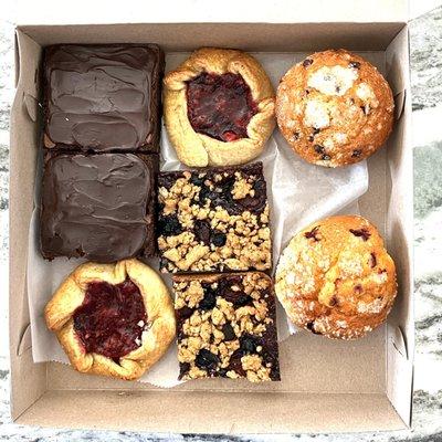 A box of assorted desserts.