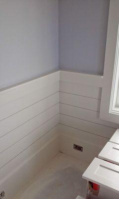 Half wall shiplap with window trim and paint