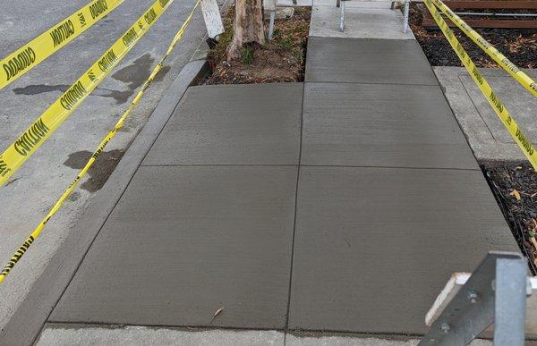 Photo of the repaired sidewalk and curb