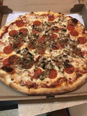 Large sausage mushroom and pepperoni pizza