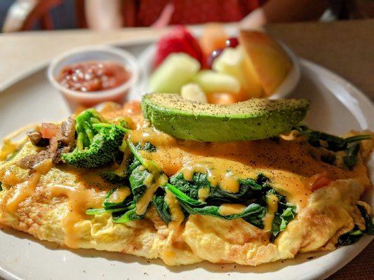 Veggie omelette with avocado and house salsa.