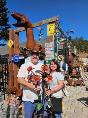 Happy customers with their Metal Flowers purchased at Cambria Garden Art.