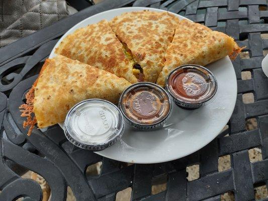 Quesadilla with mushrooms, onions, green peppers, and hashbrown, two salsas, and sour cream. $8.95