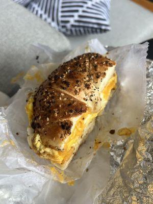 Everything bagel with scrambled egg and cheddar cheese