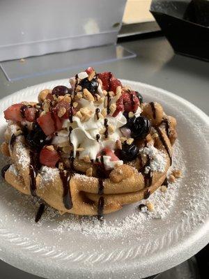 Funnel Cake w/ whipped cream, strawberries, blueberries, and chopped peanuts