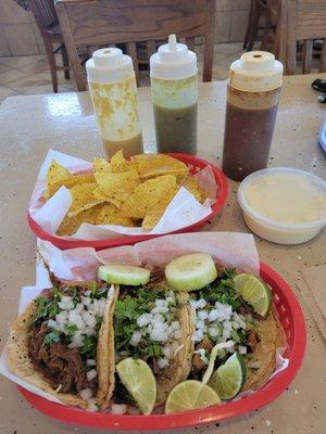 Shredded beef , shredded pork and elpastor taco. Queso and chips