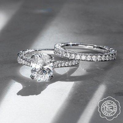 Oval diamond engagement ring and diamond wedding band